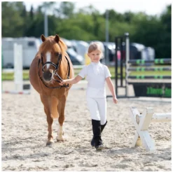 Kinder black forest kids Turnierbekleidung<Turniershirt mit Rüschen